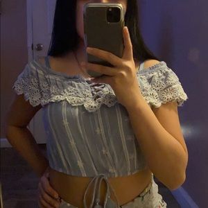 Crop top, off the shoulders, and with a bow